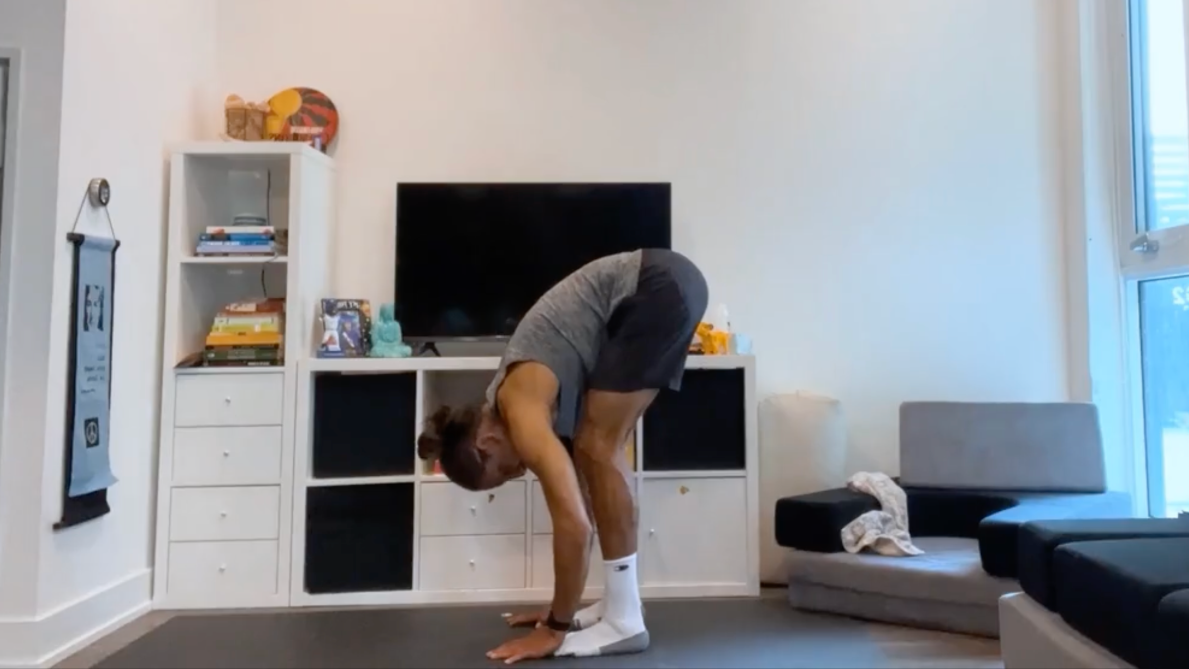 Teacher Jaffer Hussain in Standing Forward Bend, Uttanasana in Sanskrit